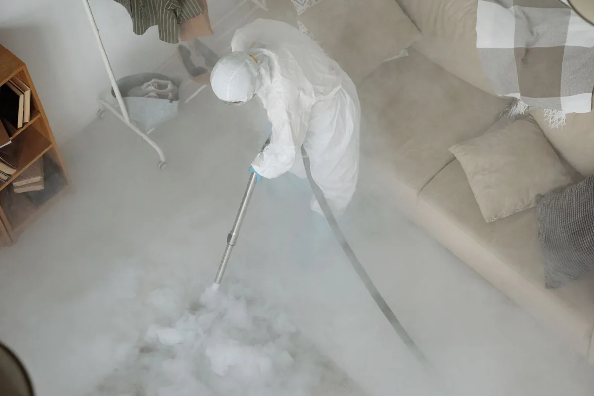 Biohazard cleanup technician in protective equipment, East Village, CT